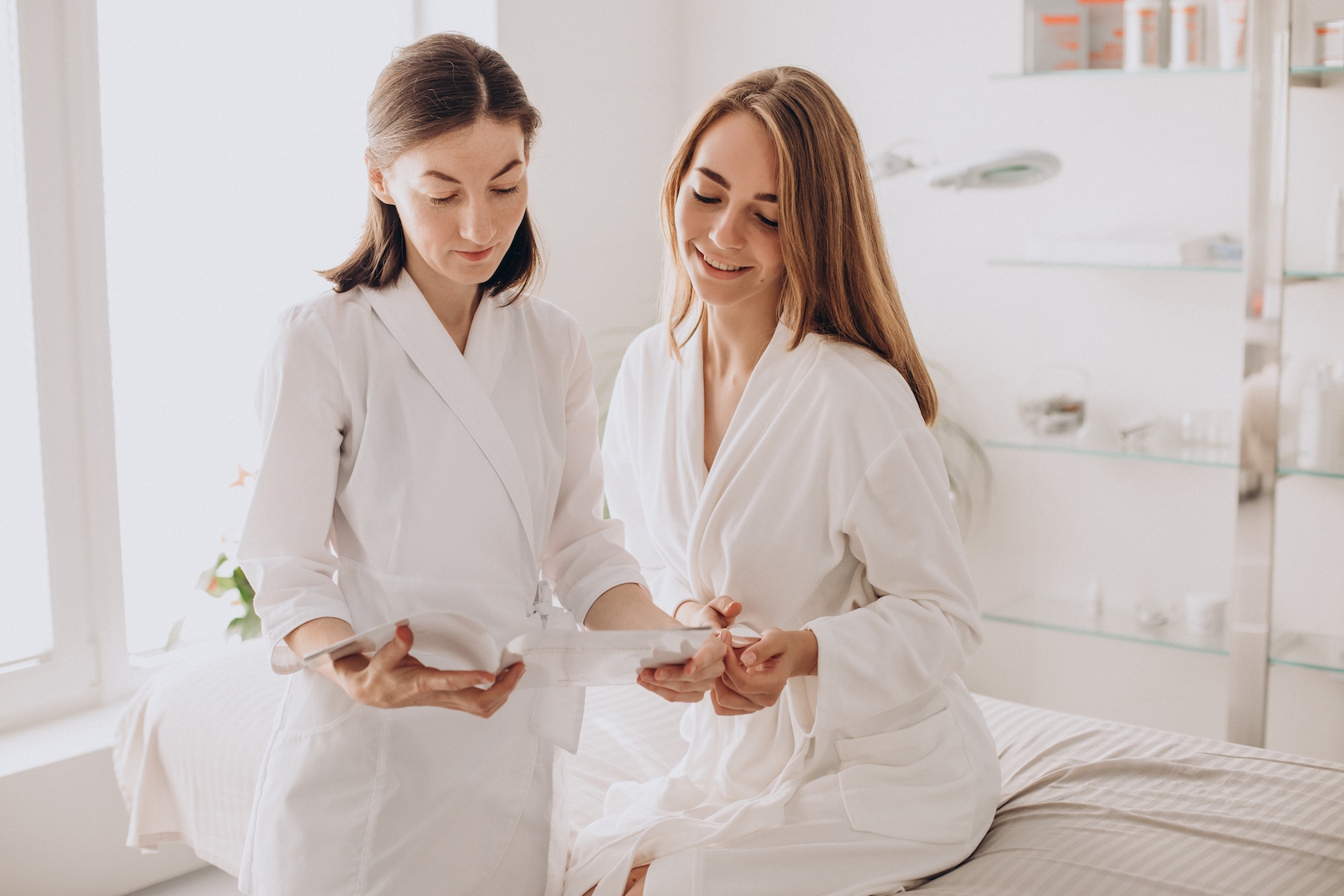 Woman consulting with doctor about treatment